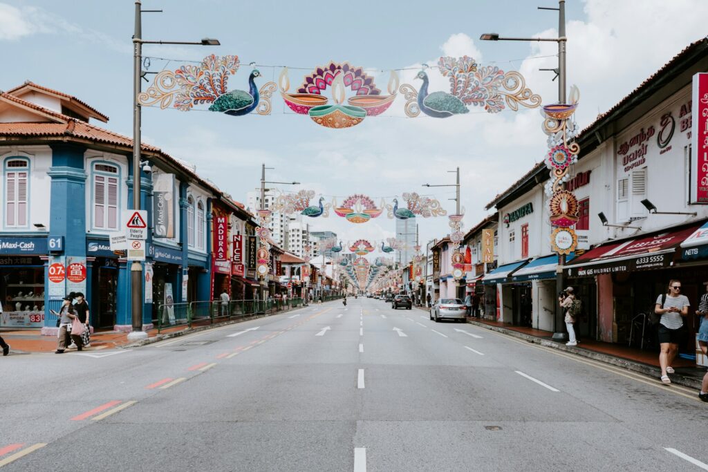 Singapore Heritage Districts : A bustling Serangoon Road alive with Bollywood music and vibrant storefronts.