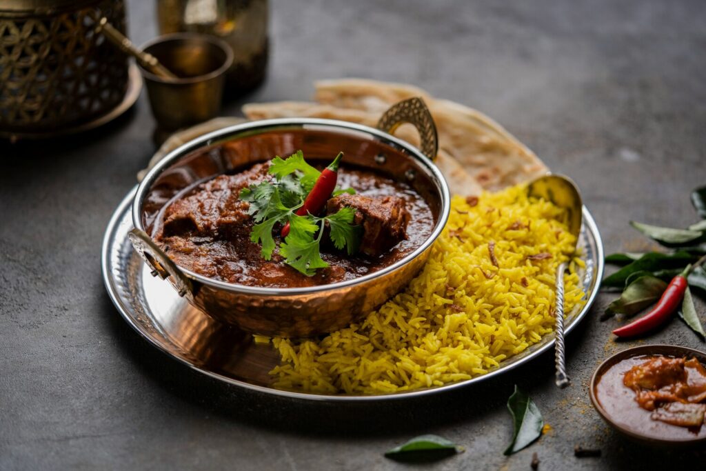 Little India In SG : Authentic Hyderabadi biryani, a festive feast of rice, meat, and tradition.