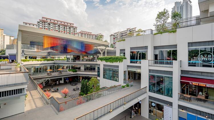 Singapore Neighbourhood : One Holland Village Mall, a modern lifestyle hub blending retail, dining, and community spaces.