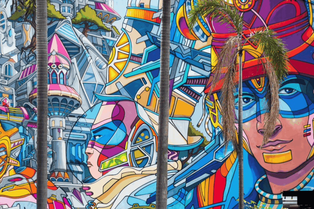 Vibrant mural painted on a large wall along Victoria Street in Little India, part of the dynamic Singapore art scene where street art, urban art, and graffiti by local and international artists transform public spaces into open‑air art exhibitions. This striking visual arts piece blends art deco influences with traditional motifs, echoing works seen at the Singapore Art Museum, National Gallery Singapore, and during the Singapore Biennale. The composition reflects art forms from fine arts to performing arts, inspired by culture, history, and the multicultural society of Singapore—a young nation in the Asia Pacific region and Southeast Asia. Surrounded by boutique shops, main streets, and neighbourhood landmarks like Haji Lane, Clive Street, Kerbau Road, Rowell Road, and Ann Siang Hill, the scene recalls the modern way artists such as Yip Yew Chong, Ernest Zacharevic, and Novena Angela have helped develop art in Singapore. The imagery nods to Chinese immigrants, India, China, and Asia, weaving in food, music, and life as part of the city’s important role in global art. References to Tiong Bahru, Chinatown, the central business district, and even pop culture like Crazy Rich Asians highlight how shops, streets, and events connect early exhibitions to the new generation of emerging artists. This modern city’s contemporary scene features sculptures, collection highlights, and inspired ideas showcased at Art SG, the Nanyang Academy, and venues supported by the National Heritage Board, making it a must‑visit for those who want to find street art in Singapore and explore its world of creativity.