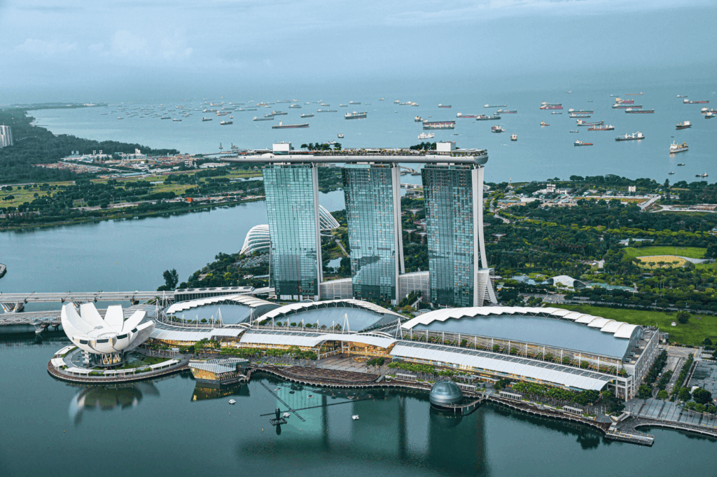Iconic Marina Bay Sands hotel and ArtScience Museum located in the heart of Singapore, surrounded by the vibrant melting pot of Singapore neighbourhoods such as Chinatown, Kampong Gelam, Little India, Joo Chiat, Tiong Bahru, Holland Village, Robertson Quay, Clarke Quay, Orchard Road, and the financial district. This bustling area, easily accessible for a trip and easily accessed with easy access from Changi Airport, is within walking distance to numerous restaurants, hawker stalls serving good food, bars, malls, and shopping streets. Visitors can explore local Peranakan culture, colourful shophouses, fresh produce markets, and cultural attractions, or head south to Sentosa Island and Sentosa Cove resorts, north to Bukit Timah, Bukit Batok, and Bukit Panjang residential areas, east to East Coast Park, Pasir Ris, Eastpoint Mall, and Paya Lebar, and west to Dempsey Hill dining. Highlights include the Singapore River, Singapore Zoo, nightlife, nature lovers’ spots, and neighbourhoods popular with young couples, expats, and residents. This city offers the best neighbourhood options for culture, history, food, and island escapes, making it a point to visit for those who want to indulge in the country’s world-class attractions, houses, and heritage.