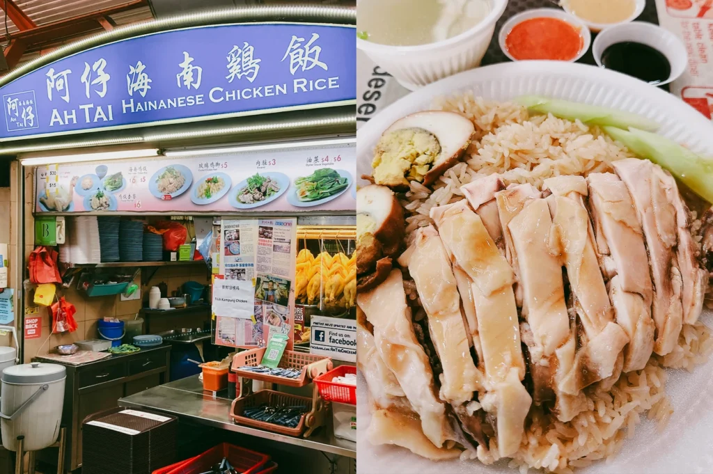 Left: An eye-level, medium-wide shot of the Ah Tai Hainanese Chicken Rice stall, featuring a blue curved sign, illustrated menu boards, and hanging cooked chickens visible behind a glass display case. Right: A close-up, top-down shot of a plate of Hainanese chicken rice covered with neatly sliced poached chicken, served alongside halved seasoned eggs, cucumber slices, a bowl of clear broth, and dipping sauces.
