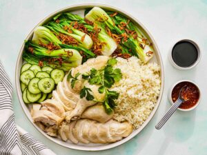 Hainanese Chicken Rice Singapore : A perfectly poached chicken served with fragrant rice and chilli sauce
