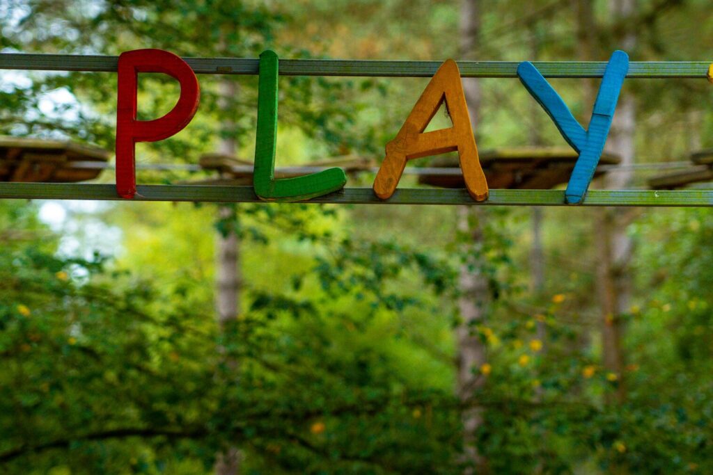 Best Park in SG: Children exploring a nature playgarden built with wood, sand, and stone.