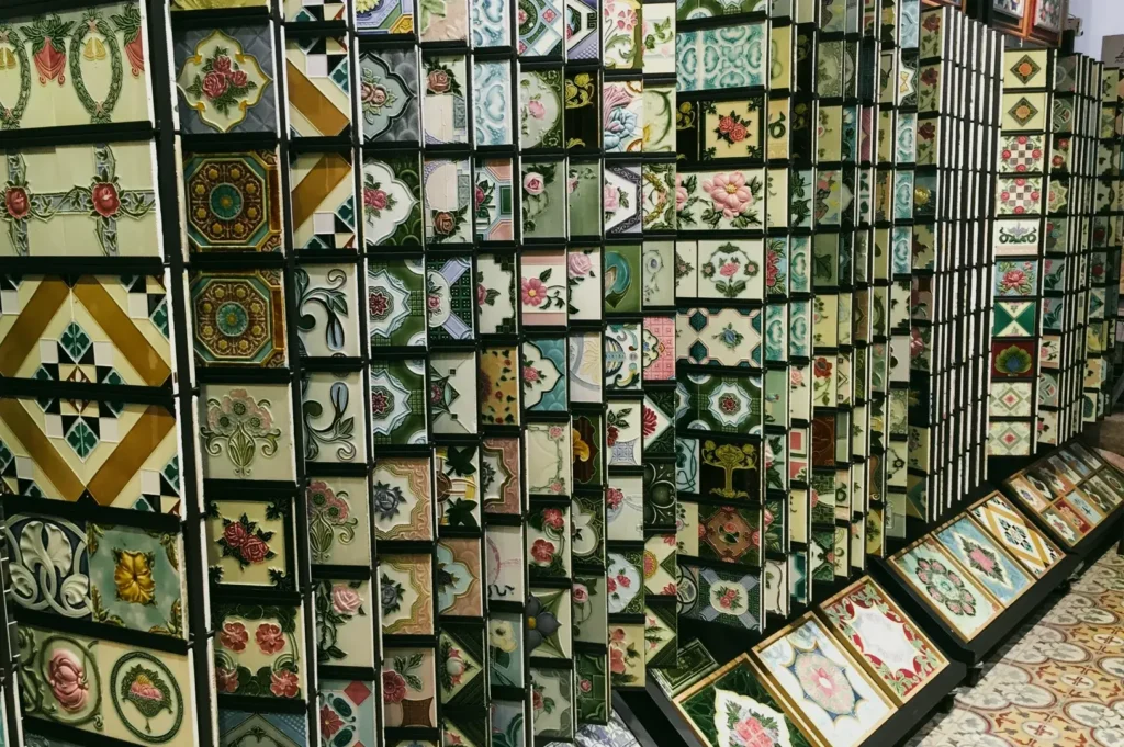 Decorative ceramic tile display featuring intricate floral and geometric patterns, showcasing traditional and vintage‑inspired tile designs.
