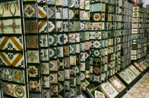 Decorative ceramic tile display featuring intricate floral and geometric patterns, showcasing traditional and vintage‑inspired tile designs.