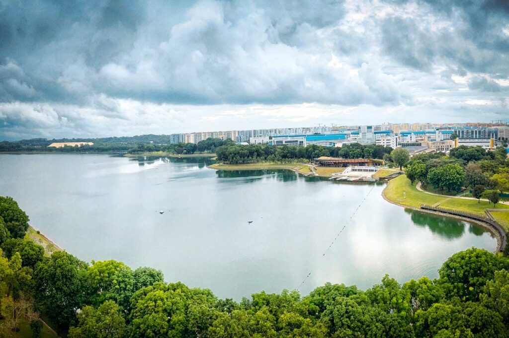 Aerial view of Bedok Reservoir surrounded by trees and residential buildings.