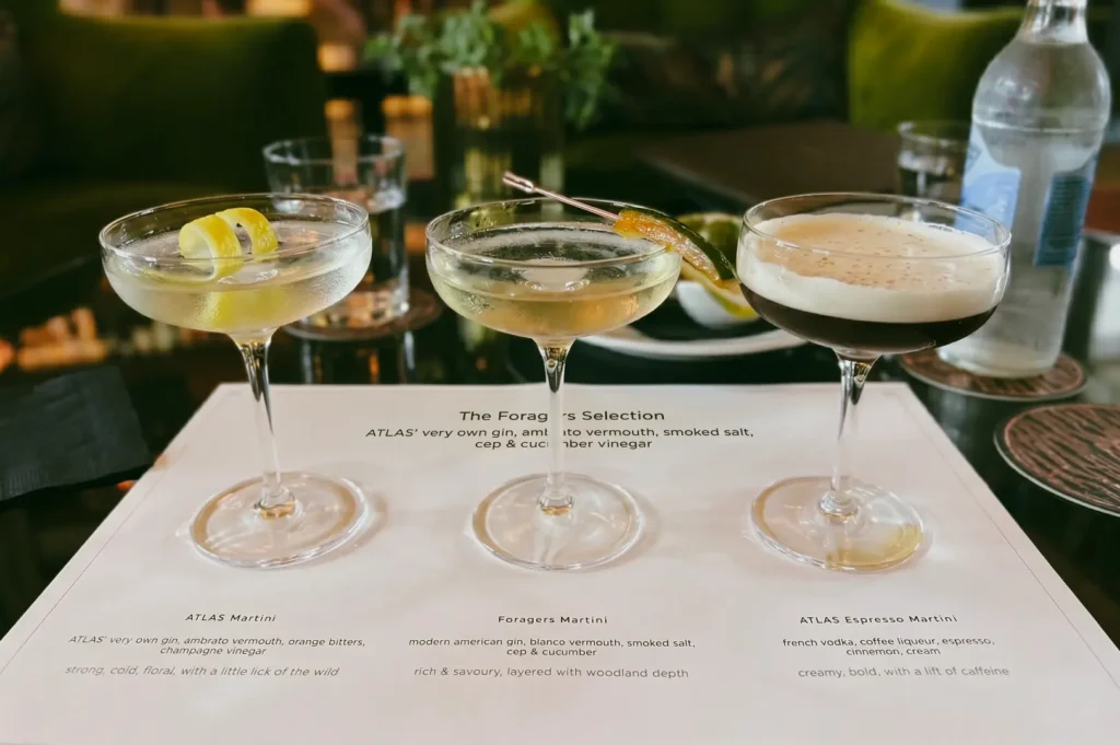 Close-up shallow depth of field shot of signature cocktails at ATLAS Bar Singapore gin palace with martinis and espresso cocktail