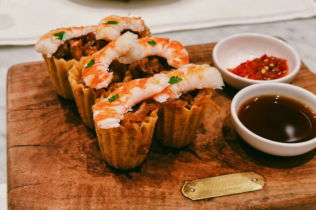 Kuay Pie Tee at Violet Oon ION Orchard with prawn topping and dipping sauces, captured in close-up macro eye-level food shot